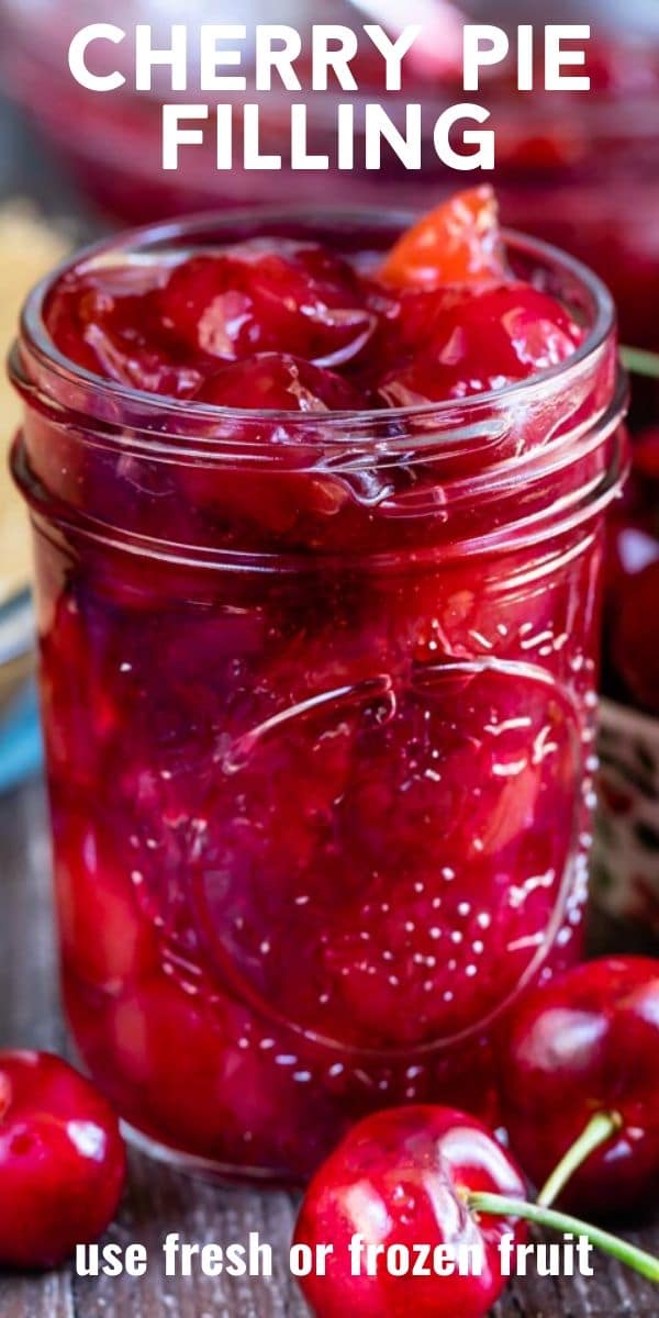Cherry pie filling in a mason jar with recipe title on top of photo