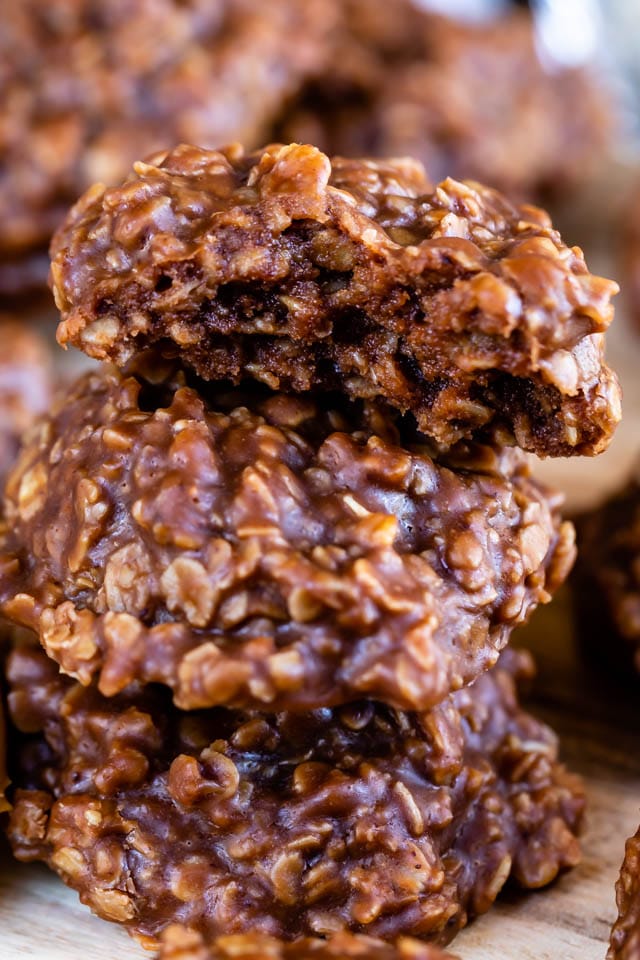 Close up stack of no bake cookies with top cookie cut in half