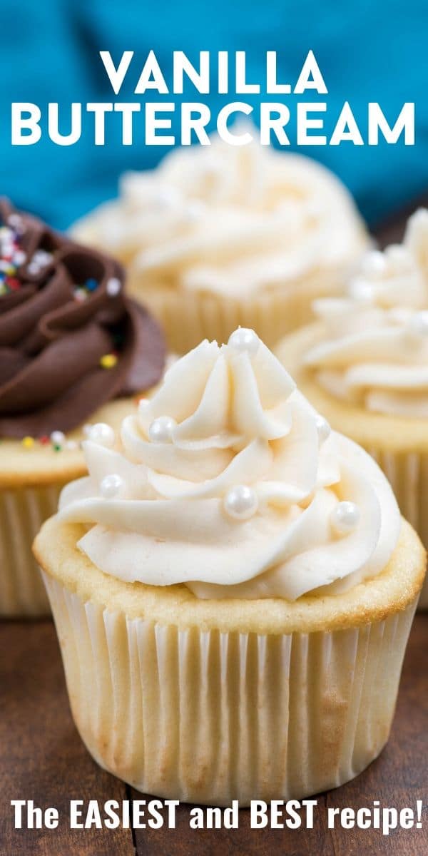 Vanilla cupcakes on wood table with vanilla buttercream frosting and recipe title on top of image