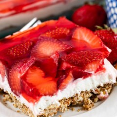 One square of strawberry pretzel salad on a white plate
