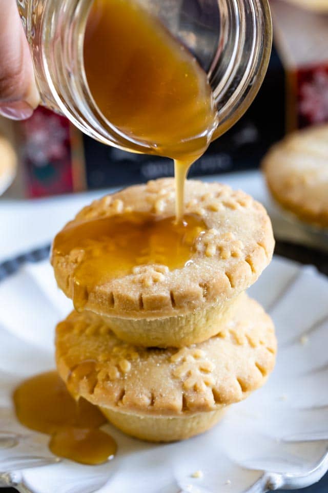 pouring caramel sauce over walkers mince pies