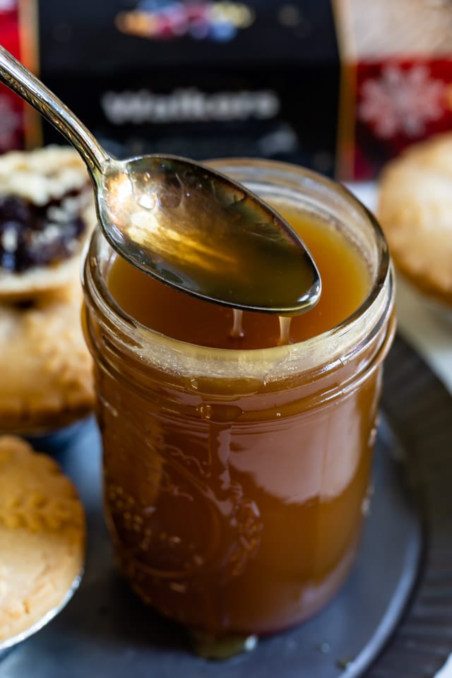 jar of caramel sauce with spoon