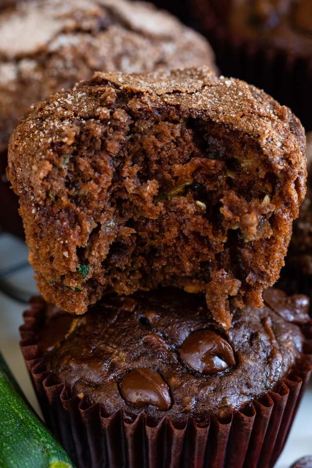Close up of chocolate zucchini muffin with a bite taken out