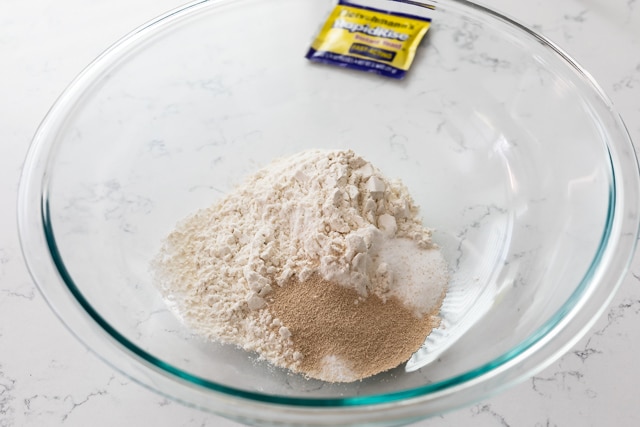 Dry ingredients before being mixed in a glass mixing bowl