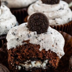Oreo cupcake cut in half to show oreo cookie inside cupcake
