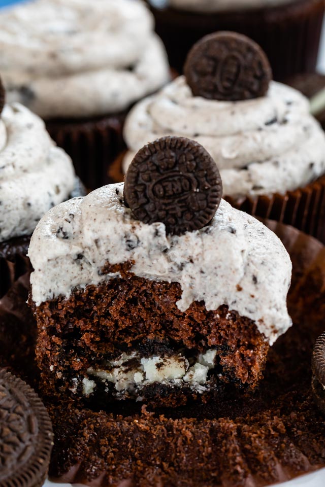 Oreo cupcake cut in half to show oreo cookie inside cupcake