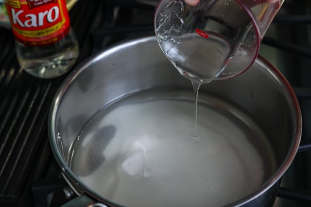 Light corn syrup being poured into pot on stove