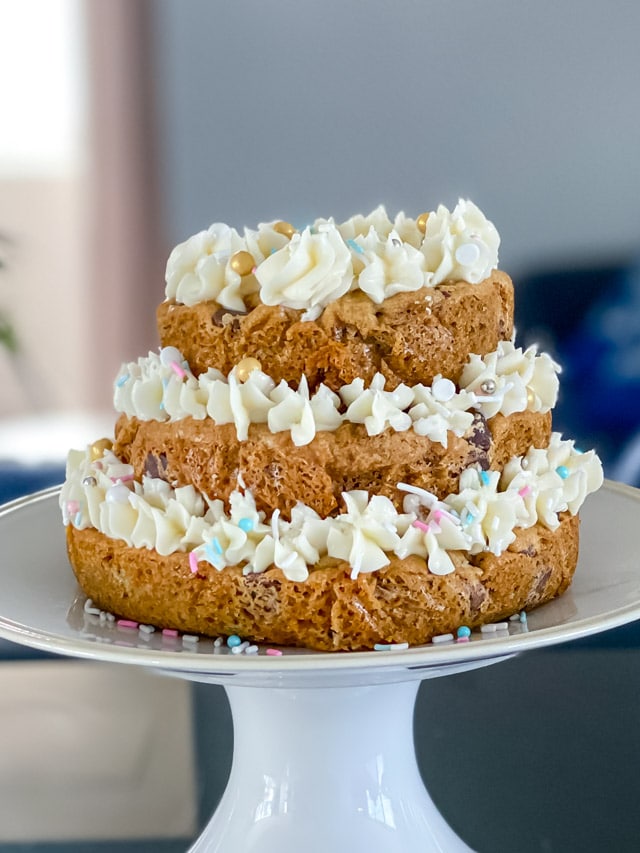 3 tiered cookie cake on white plate