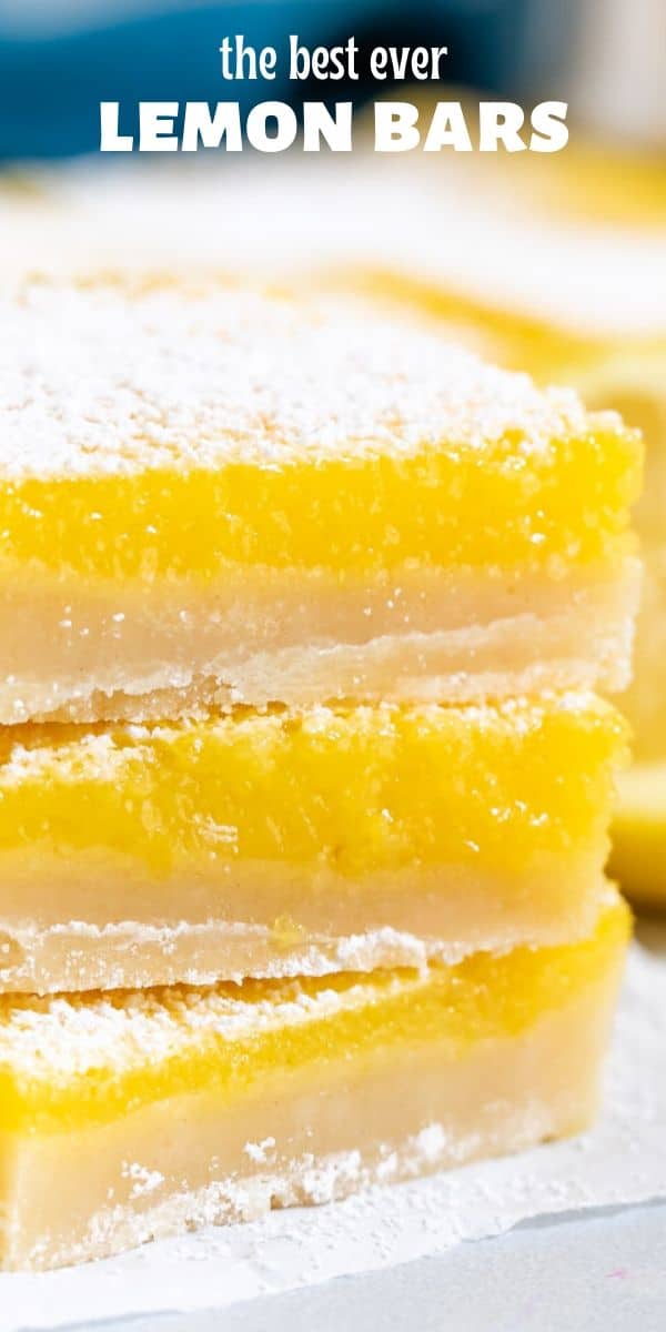 Close up photo of stack of three lemon bars on a paper towel with recipe title on top