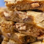 Close up of the side of the stack of toffee blondies with recipe title on top of photo