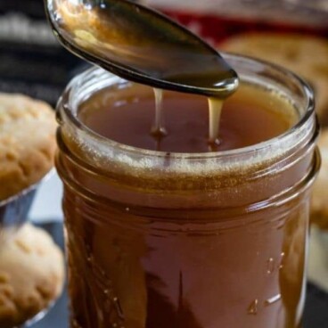 jar of caramel sauce with spoon