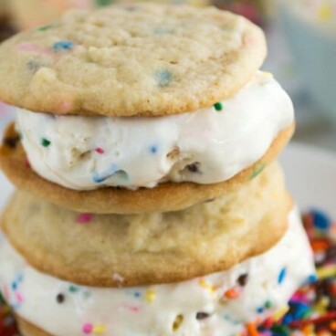 stack of ice cream sandwiches on white plate with sprinkles