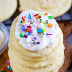 Stack of the best sugar cookies with icing and colorful sprinkles on top