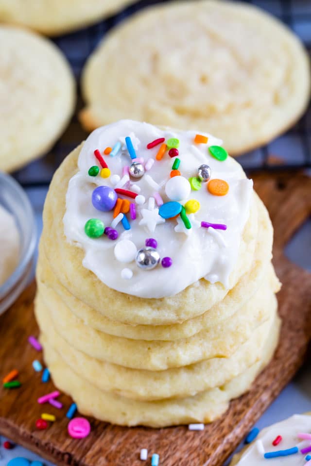 Stack of the best sugar cookies with icing and colorful sprinkles on top