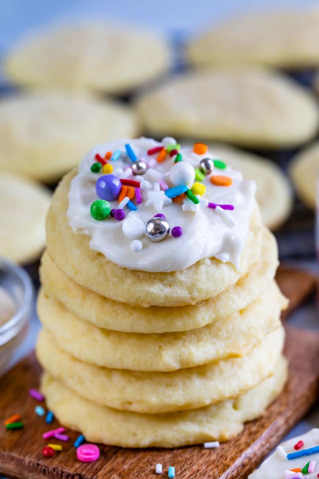 Stack of the best sugar cookies with icing and colorful sprinkles on top