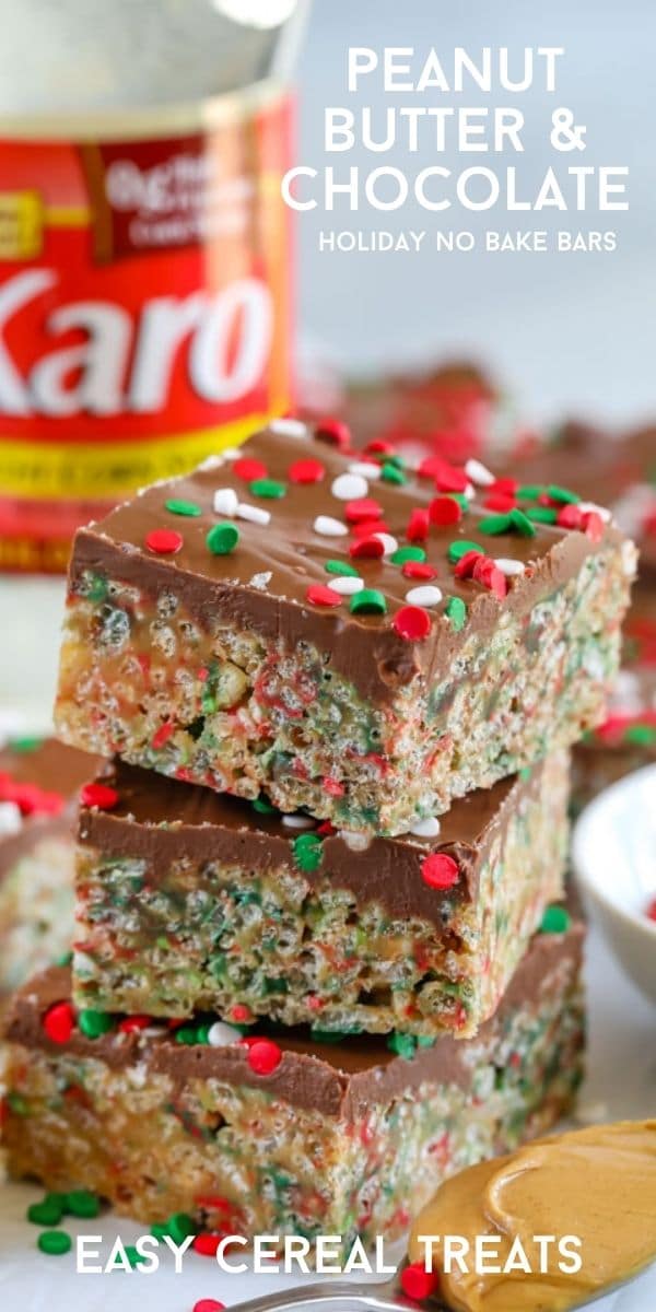 Three holiday no bake cereal bars stacked on top of eachother with corn syrup bottle in background