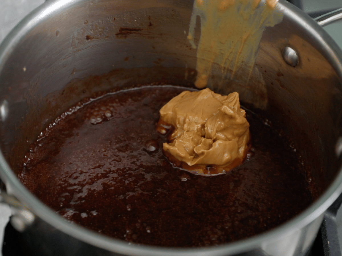 pan with chocolate mixture and peanut butter.