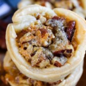 Overhead shot of mini pecan pies with recipe title on top of photo