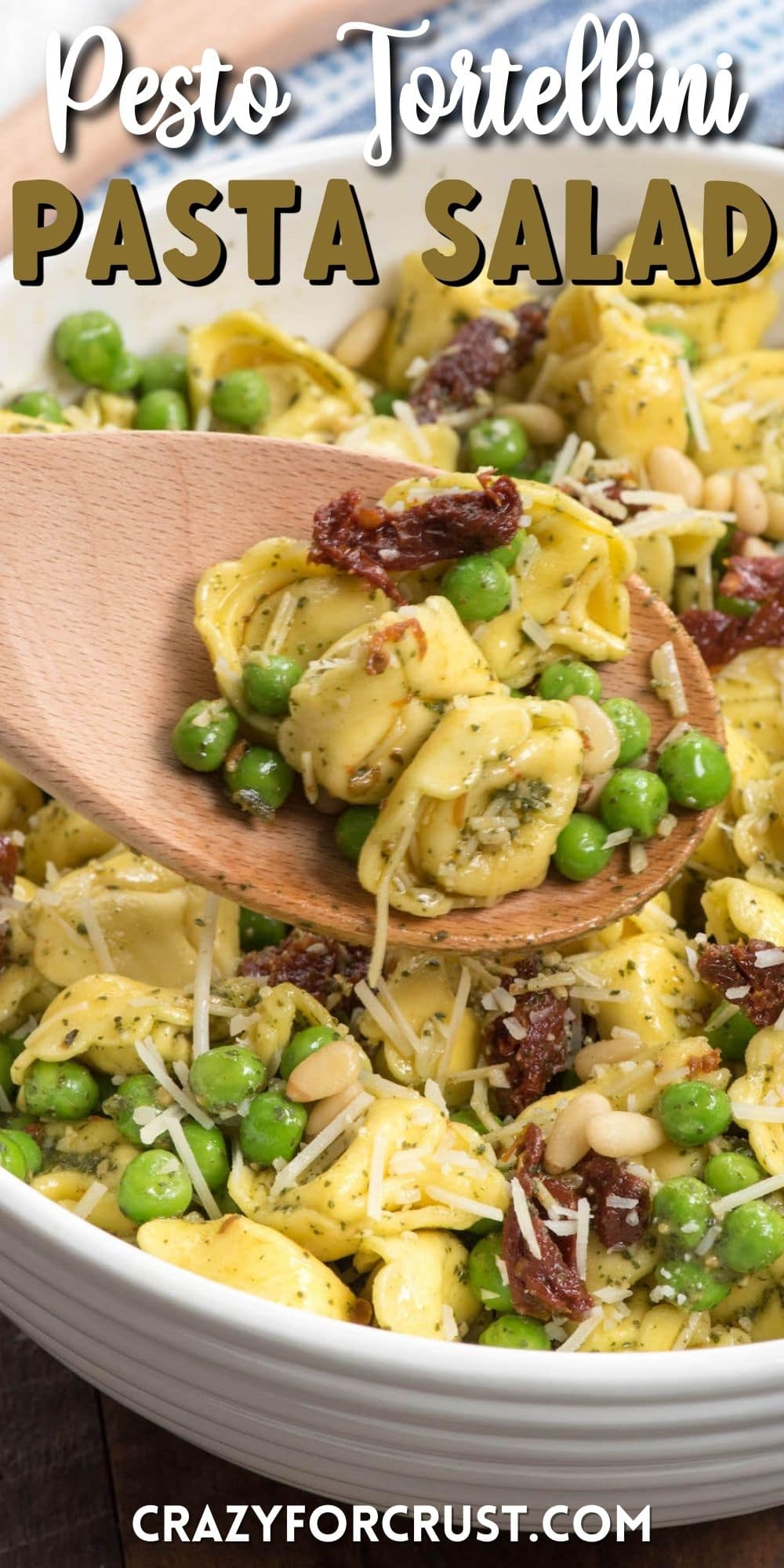 bowl of pesto tortellini with spoon holding some and words on photo