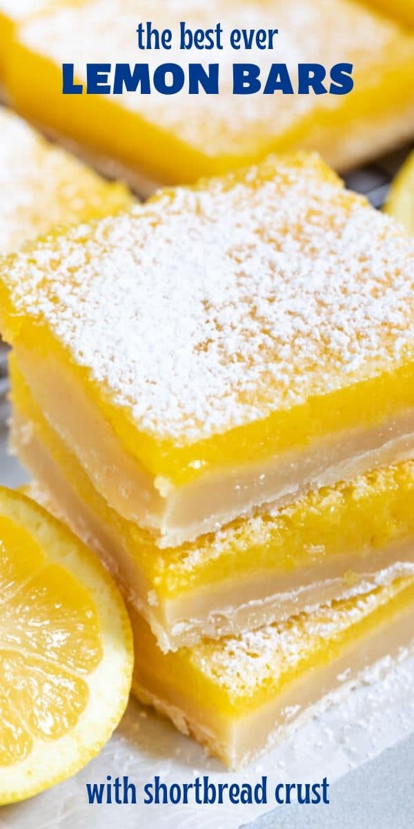 Overhead shot of stacked lemon bars with lemon wedges and powdered sugar on top and recipe title on top of image