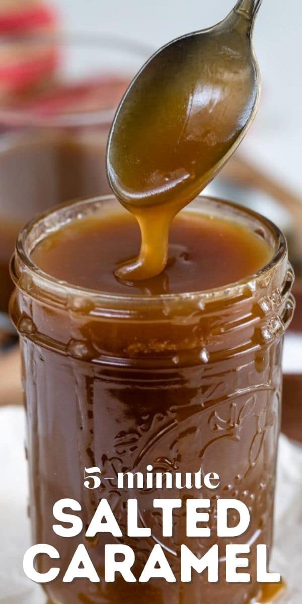 Salted caramel in a mason jar with spoon picking some of it out