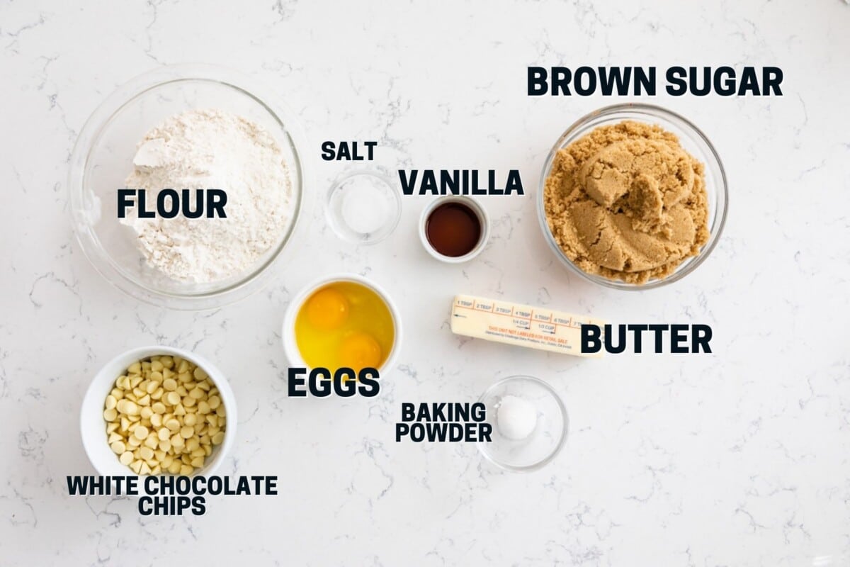 Ingredients in white chocolate blondies with words on photo.