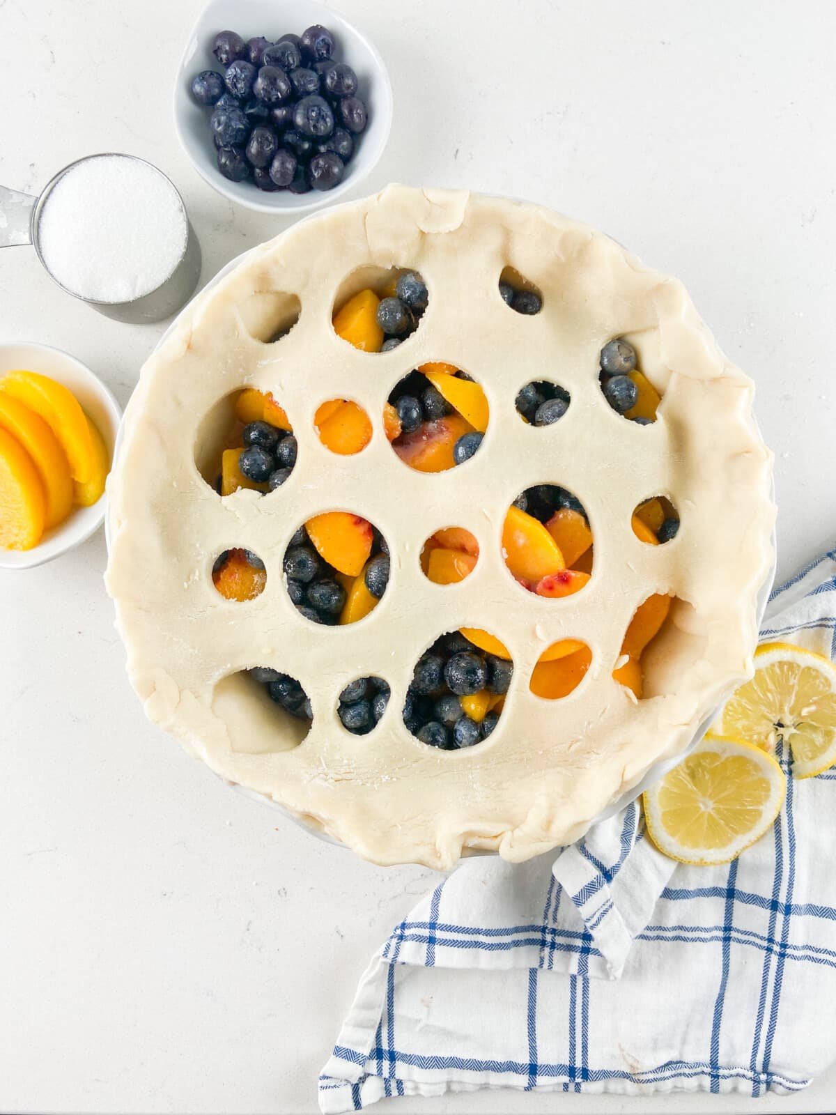 peach blueberry pie unbaked with lattice crust