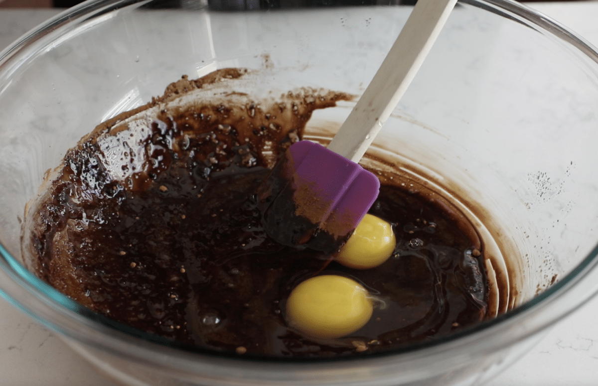 bowl with chocolate batter and eggs.