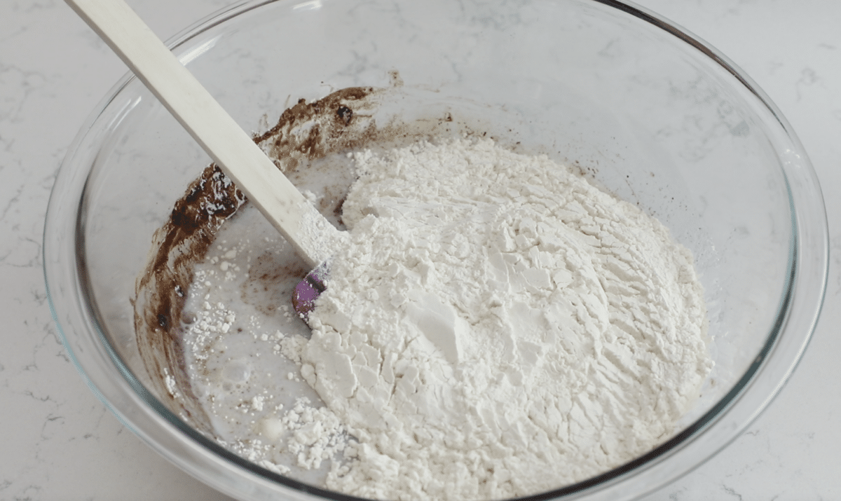 bowl with batter and flour on top.