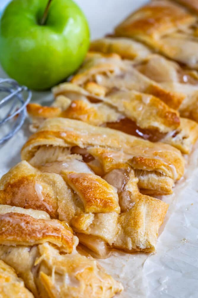 Overhead view of easy apple strudel braid cut into small pieces