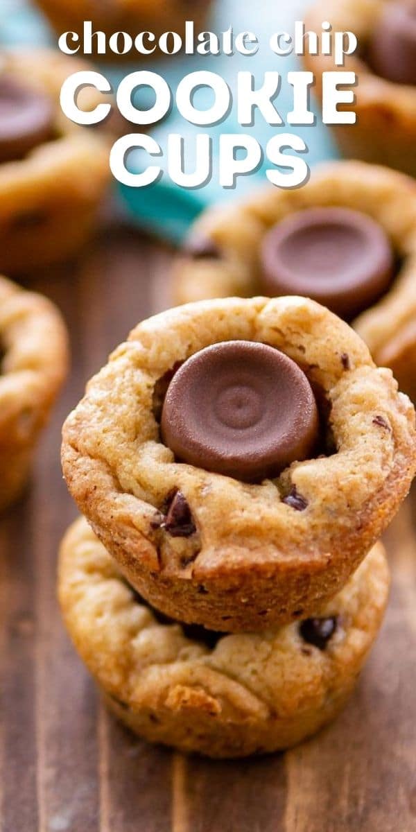 Close up of chocolate chip cookie cups stacked on top of eachother on a wood cutting board with recipe title on top