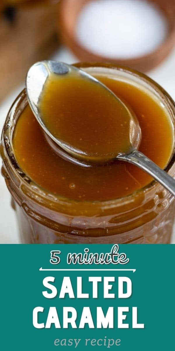 Overhead shot of salted caramel sauce in a mason jar with a spoon