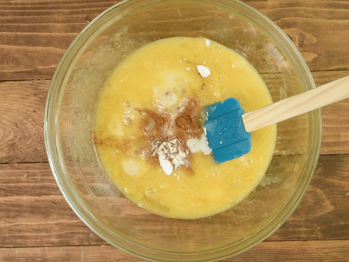 batter in bowl with cinnamon vanilla and baking soda.