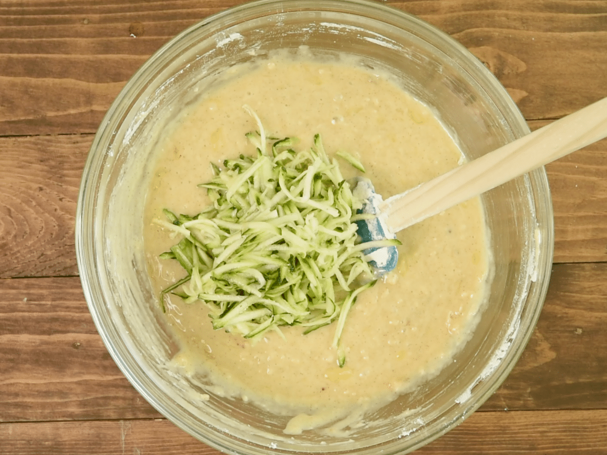 batter in bowl with shredded zucchini.