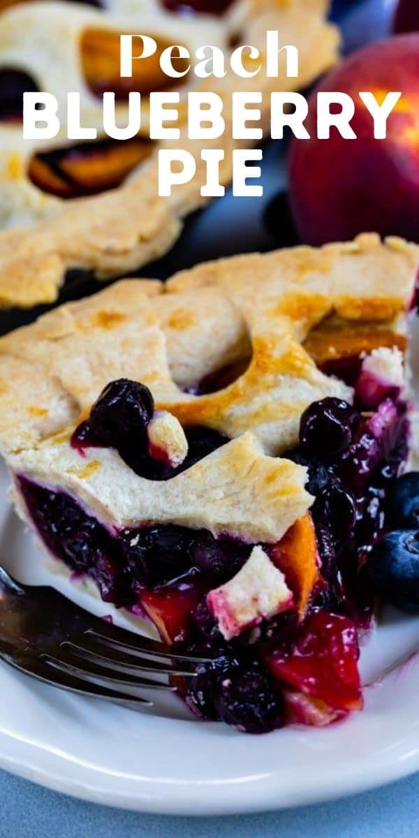 Close up shot of peach blueberry pie slice on a white plate with recipe title on top