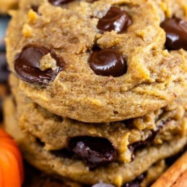 Stack of pumpkin chocolate chip cookies with recipe title on bottom
