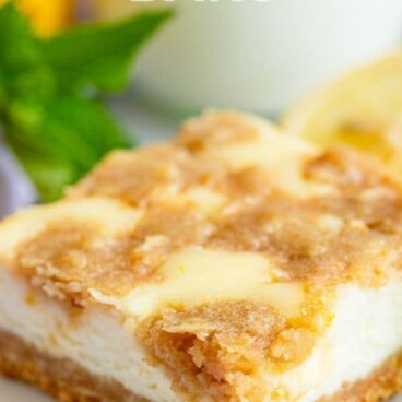 Lemon cheesecake bar on a white plate with recipe title on top of image