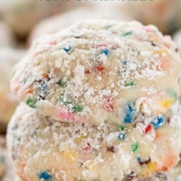 Stack of funfetti wedding cookies on a baking mat with recipe title on top of image