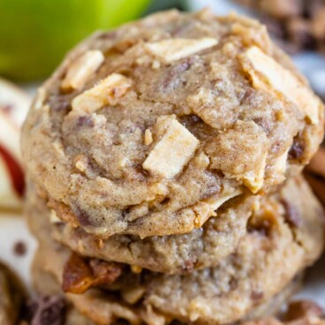 Stack of apple cookies with toffee bits all around them