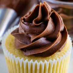 yellow cupcake with chocolate frosting