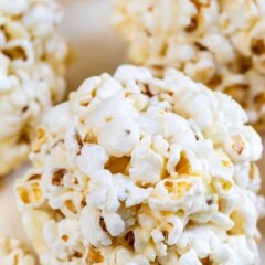 close up of popcorn ball with words on photo