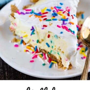 Slice of funfetti pie on a white plate with silver spoon and sprinkles in the background with recipe title on bottom of photo