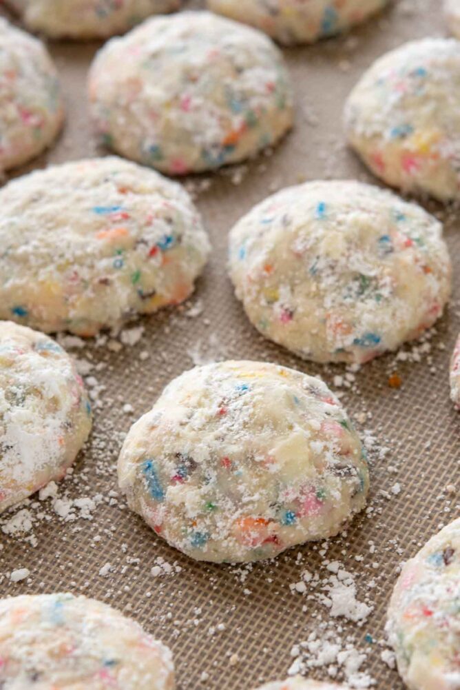 Overhead view of funfetti wedding cookies on a baking mat