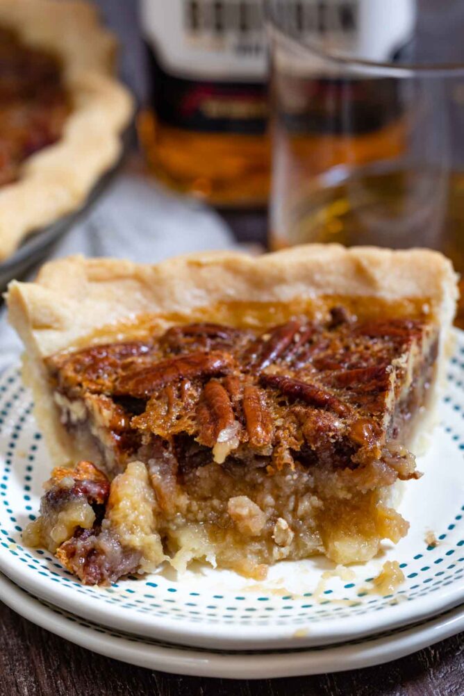 Half eaten slice of bourbon pecan pie