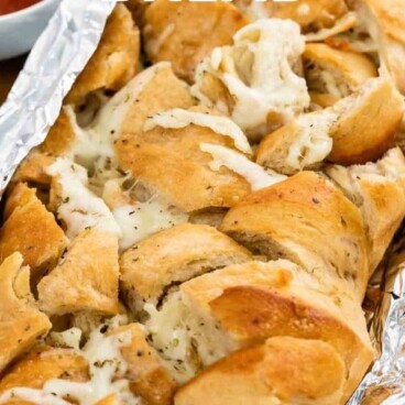pull apart bread stuffed with cheese with words on photo
