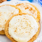 Eggnog snickerdoodles with eggnog frosting on a plate