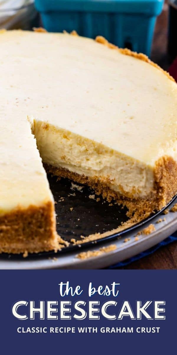 Overhead shot of classic cheesecake with one slice missing and recipe title on bottom of image