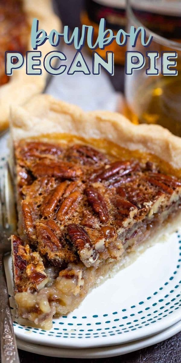 One slice of bourbon pecan pie on a white plate with blue dotted border and silver fork and recipe title on top of image