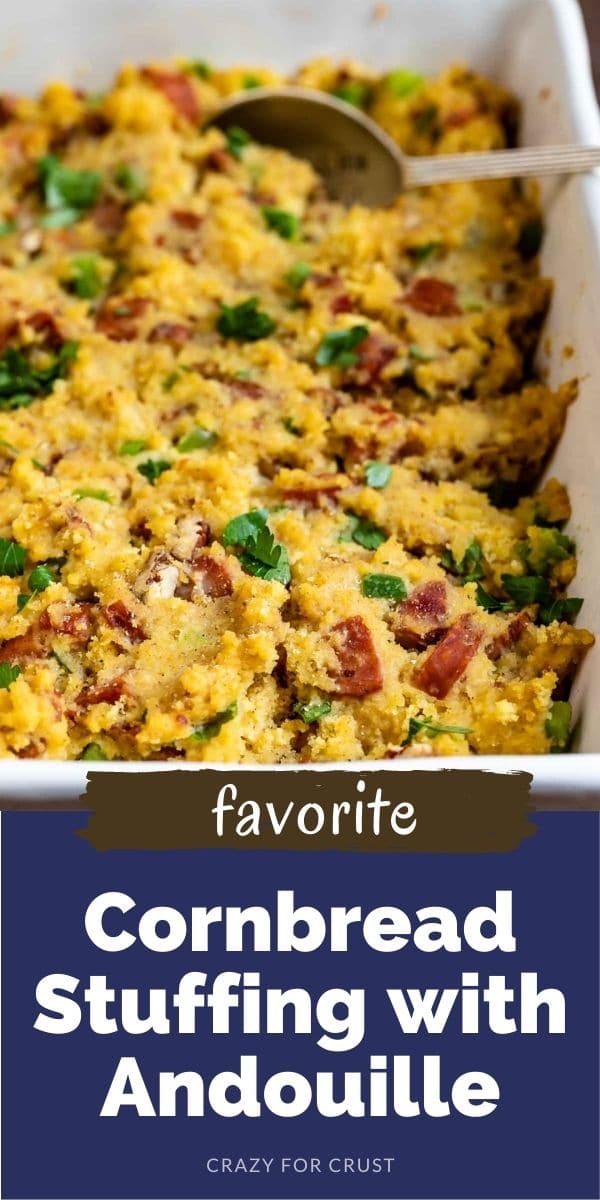 Cornbread stuffing in a white serving dish with spoon and recipe title on bottom of image