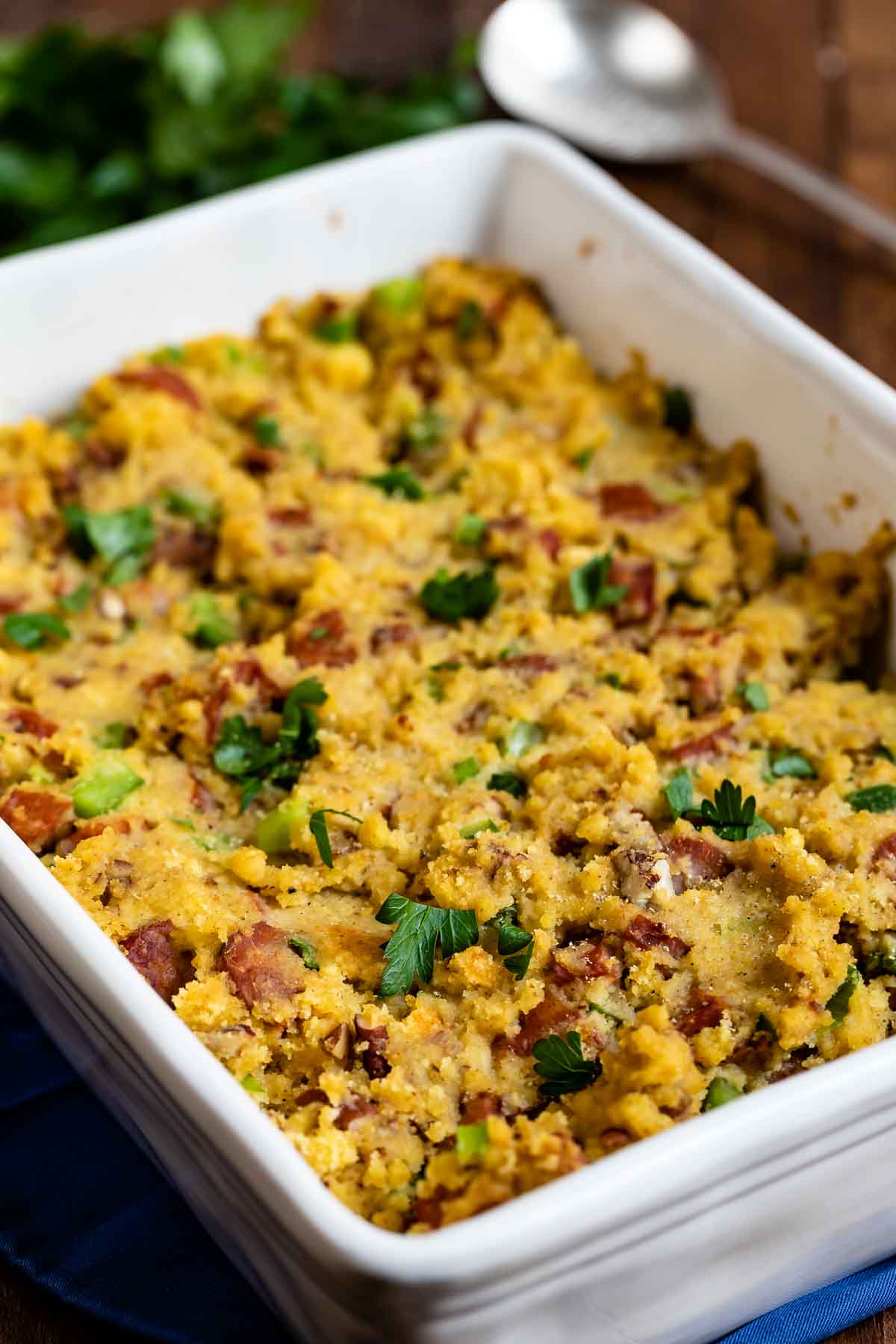 Overhead shot of cornbread stuffing in a white baking dish